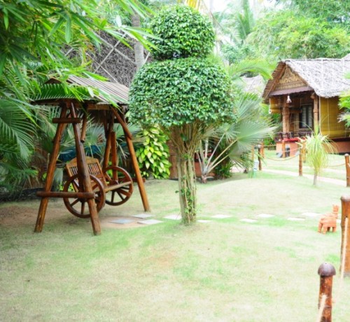 Wooden artefacts amidst greenery Wooden artefacts amidst greenery