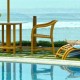 Guests relaxing by the pool and sea Guests relaxing by the pool and sea